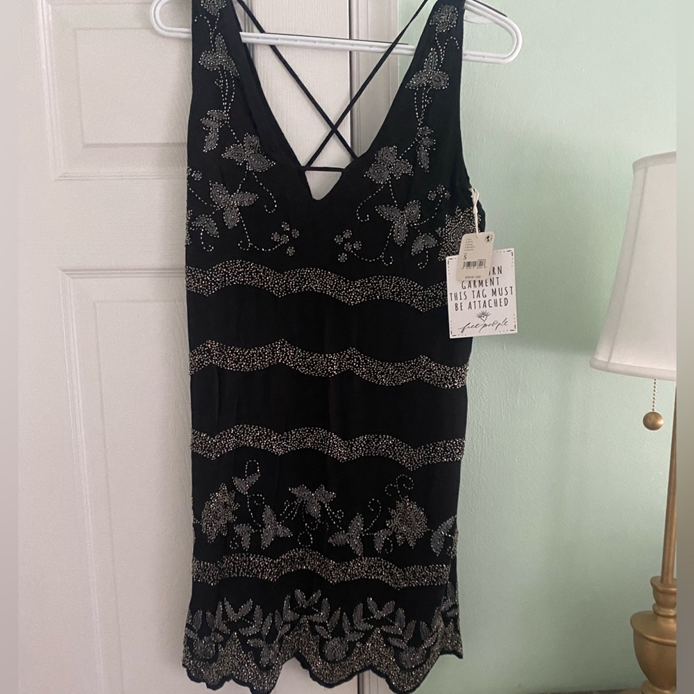Free people dress with flowered rhinestones.